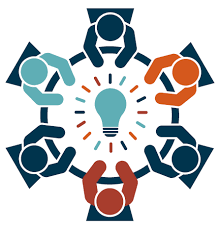 A stylized graphic showing six diverse figures seated around a circular table with a glowing light bulb in the center, symbolizing collaboration, idea sharing, and teamwork. Each figure is a different color, representing diversity and inclusion in group problem-solving or innovation.